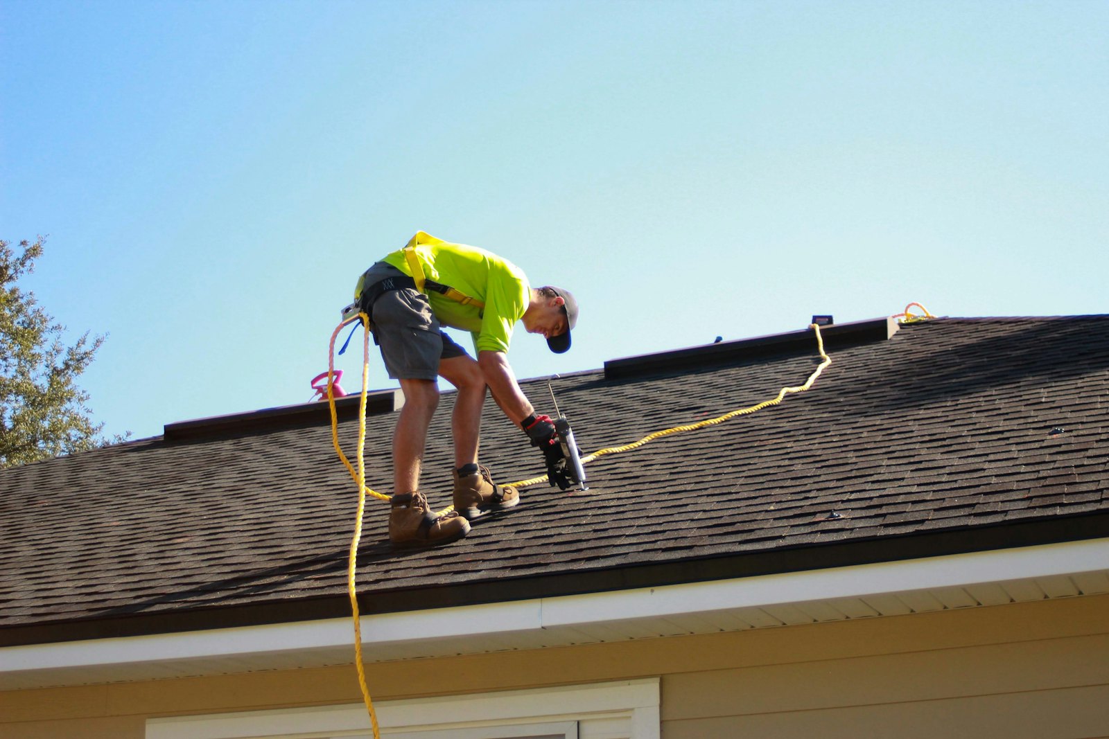 Roofing work in progress on a house roof
