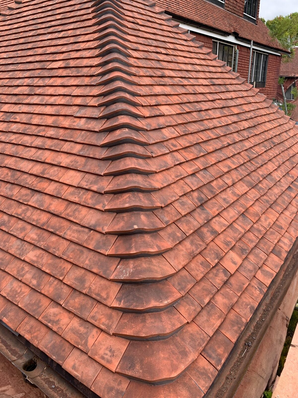 Clay ridge and hip tiles on a roof