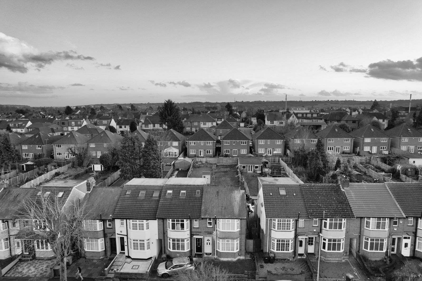 Aerial view of a UK suburban neighbourhood showing pitched roofs